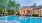 a swimming pool in front of a house