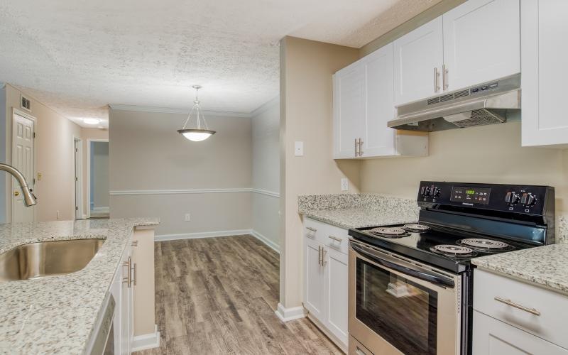 a kitchen with white cabinets