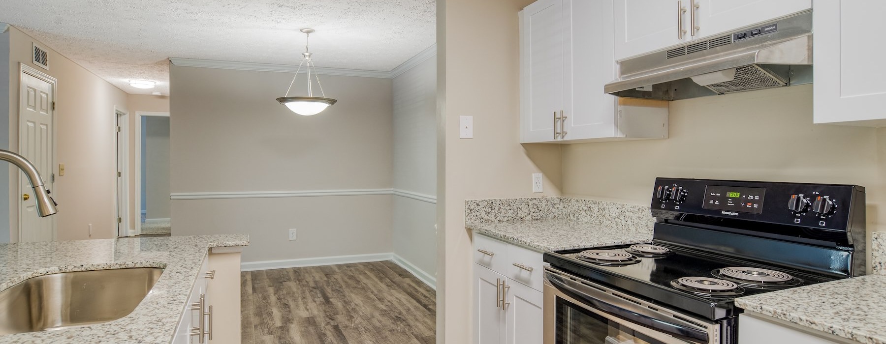 a kitchen with white cabinets