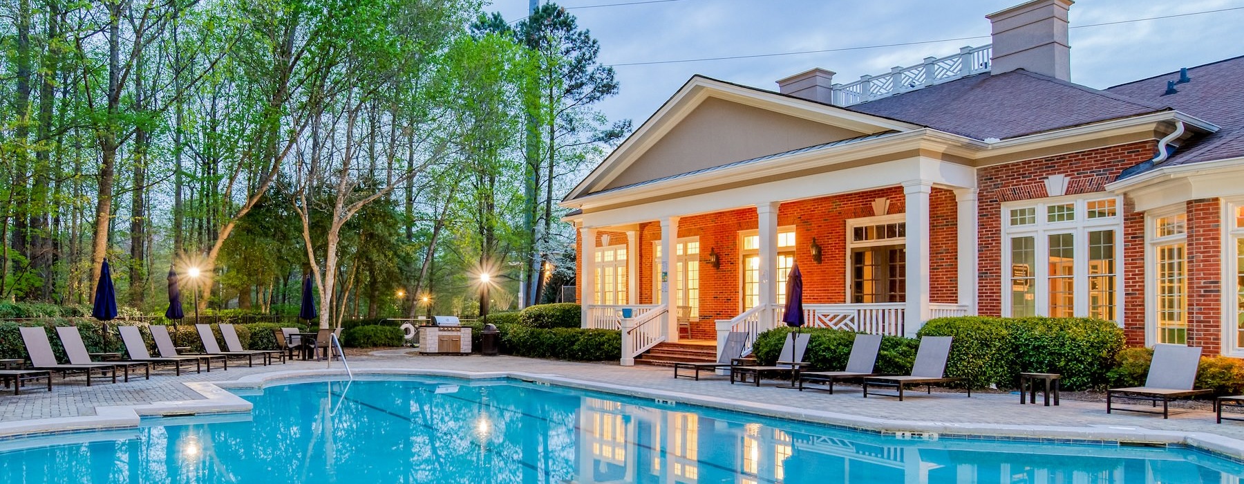 a swimming pool in front of a house