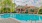 a swimming pool in front of a house