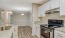 a kitchen with white cabinets