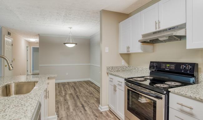 Settle into comfort at Veranda Estates a kitchen with white cabinets