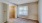 a room with a window and a carpet