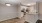 a kitchen with white cabinets